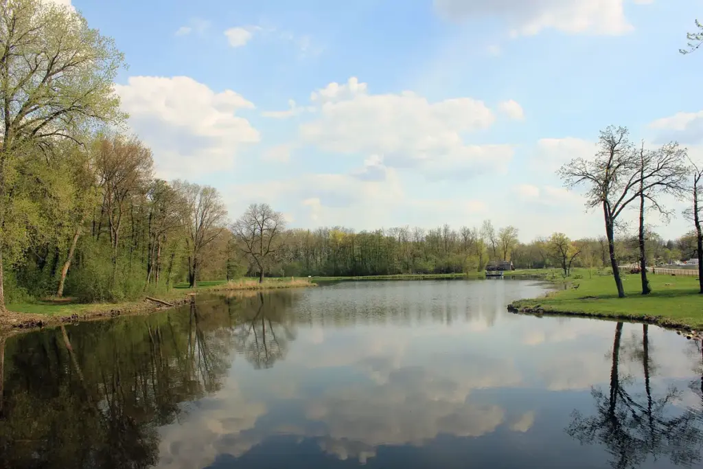 A calm lagoon at Big Foot Beach State Park, framed by spring trees